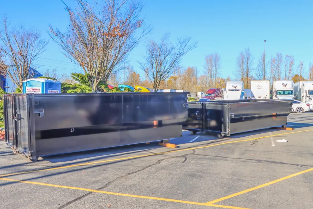 Professional dumpster rental service with roll-off container on residential driveway in Lynnfield